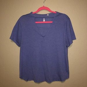 Blue shirt, cut in chest area.